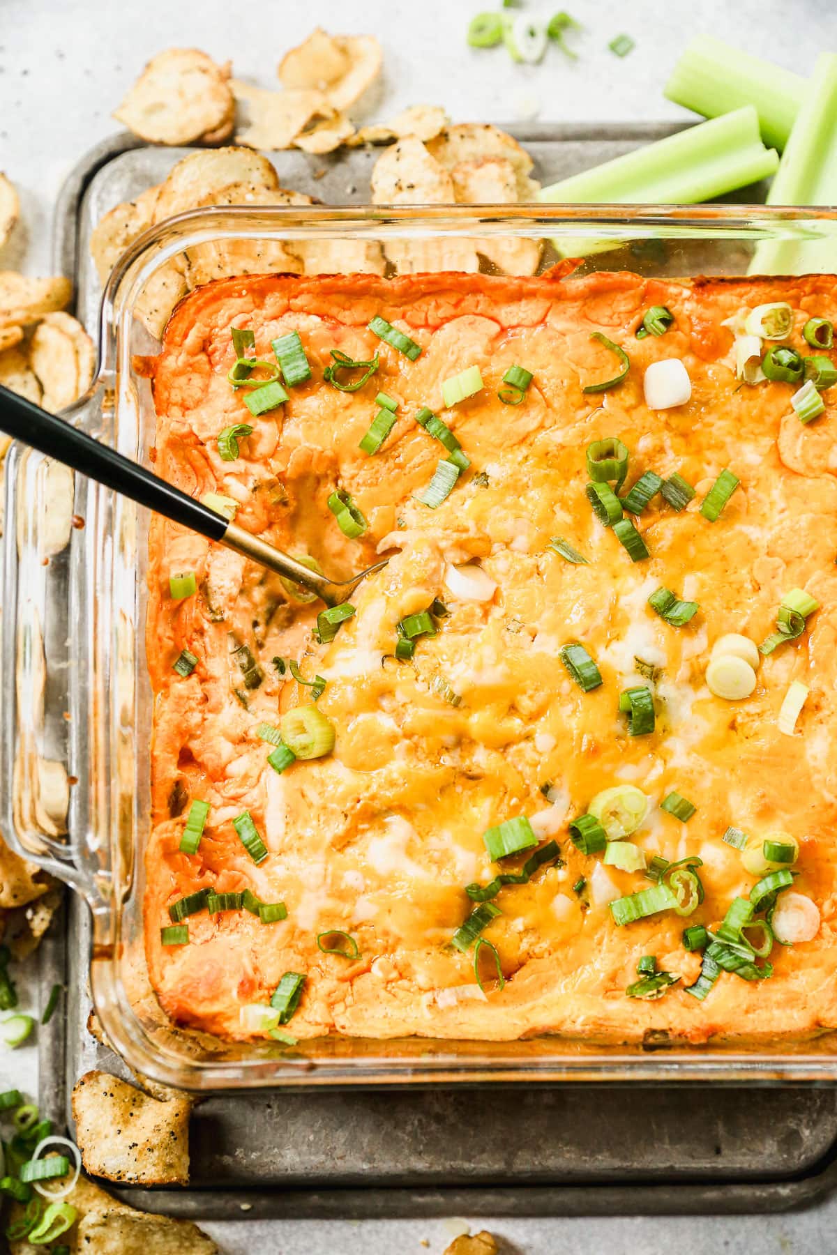 Cheesy healthy Buffalo chicken dip in baking dish