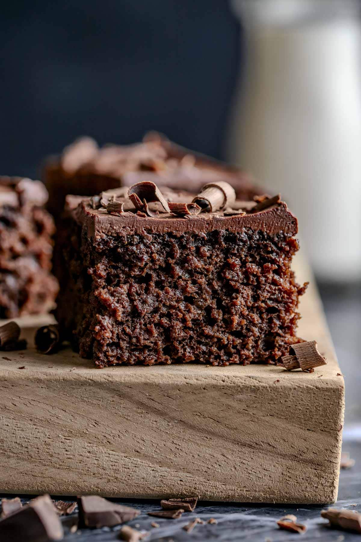 the slice of cake on a board from the side